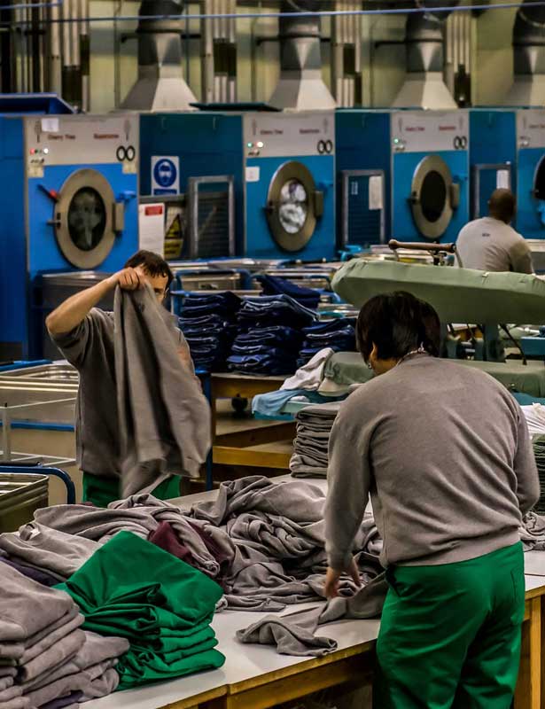 Inmates folding laundry