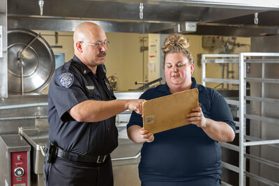 Officer speaking with Summit employee