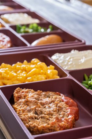 Food trays in assembly line