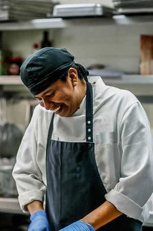 Male employee prepping food